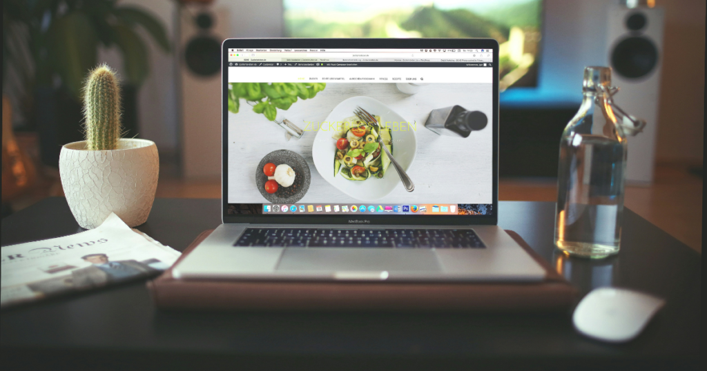Laptop with screen featuring website home page