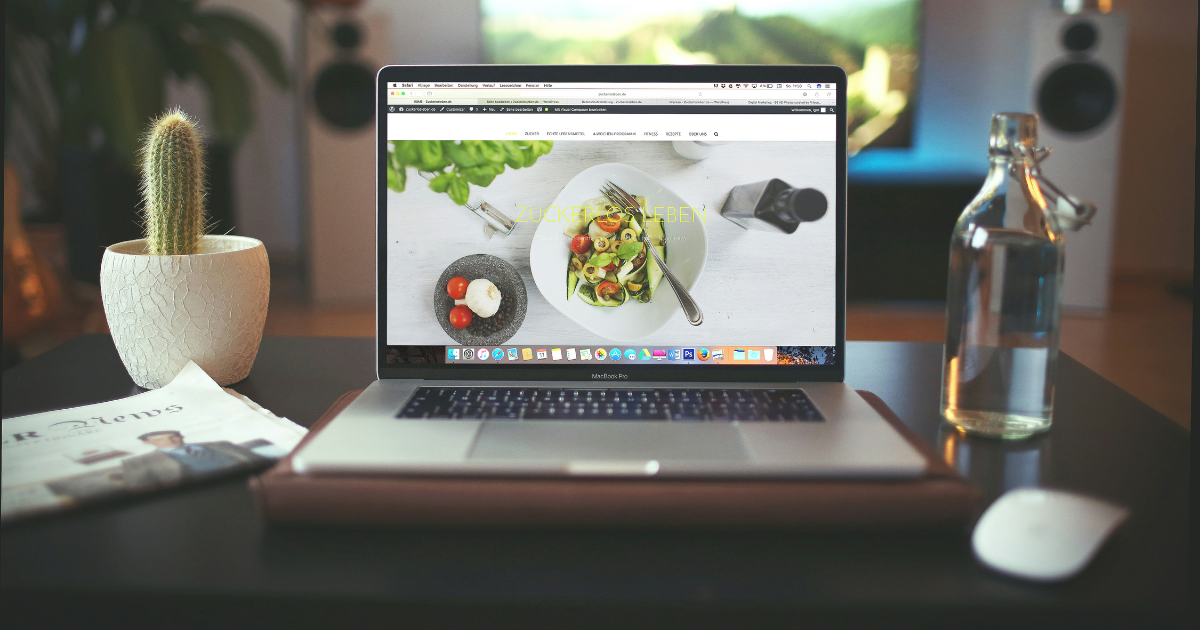 Laptop with screen featuring website home page